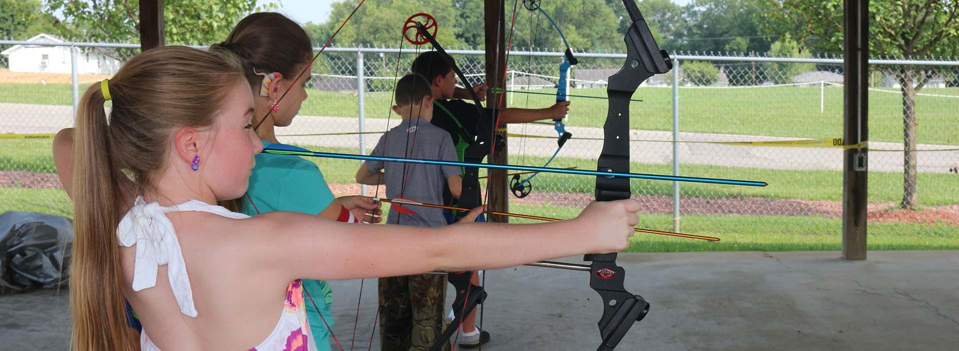 Kids shooting arrows